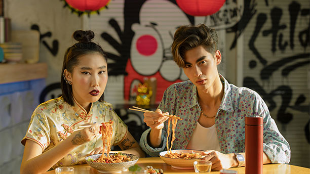 Two people eating noodles at the first slurp ramen crew meetup in Toronto